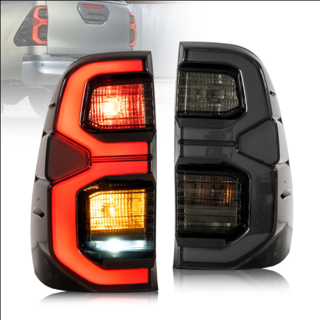 Smoked Tail Light Pair – To Fit Toyota Hilux 2015–2025 – LED Style Rear Lamps with Wiring Looms - Partzo